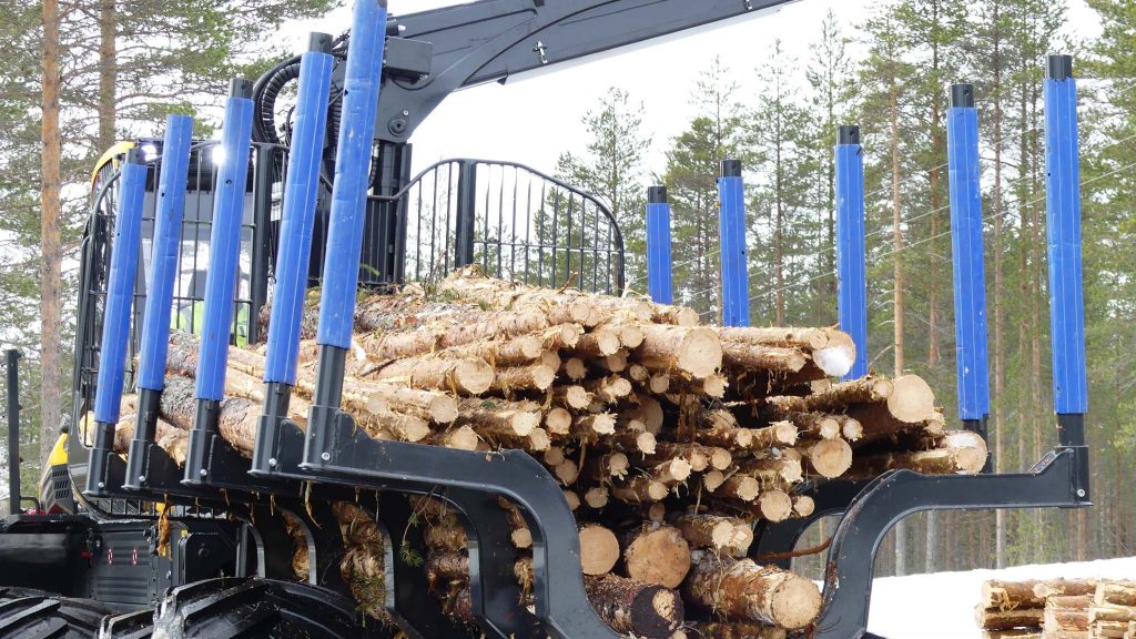 Ponsse Buffalo forwarder in the test forest. The blue pipes works as paint protection.