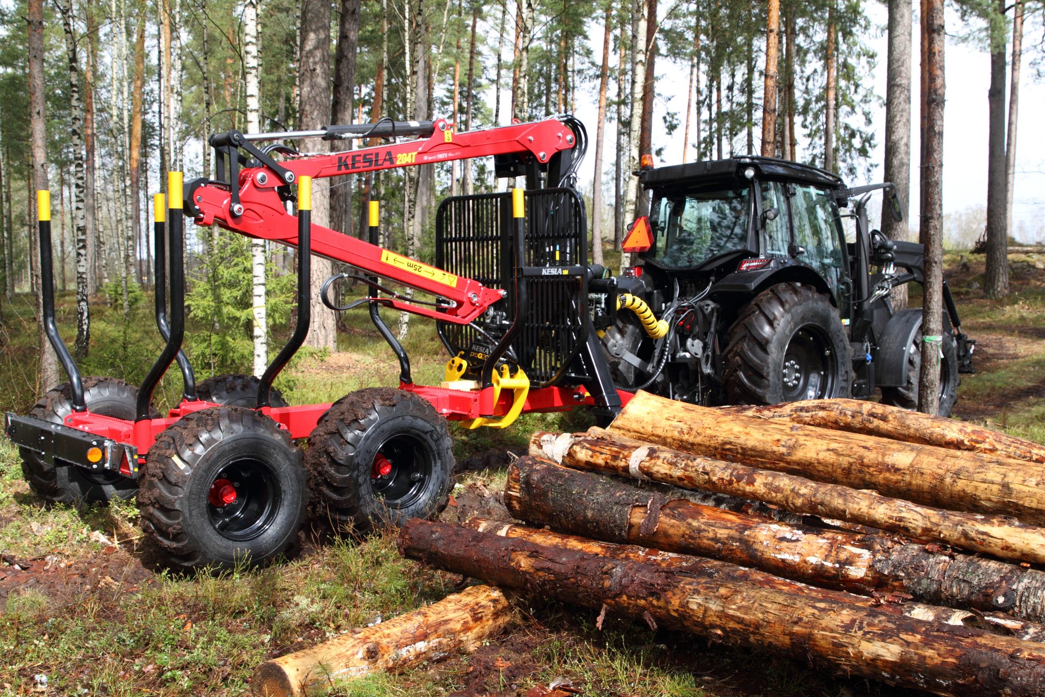 Log trailers with grapple loaders - NordicWoodJournal